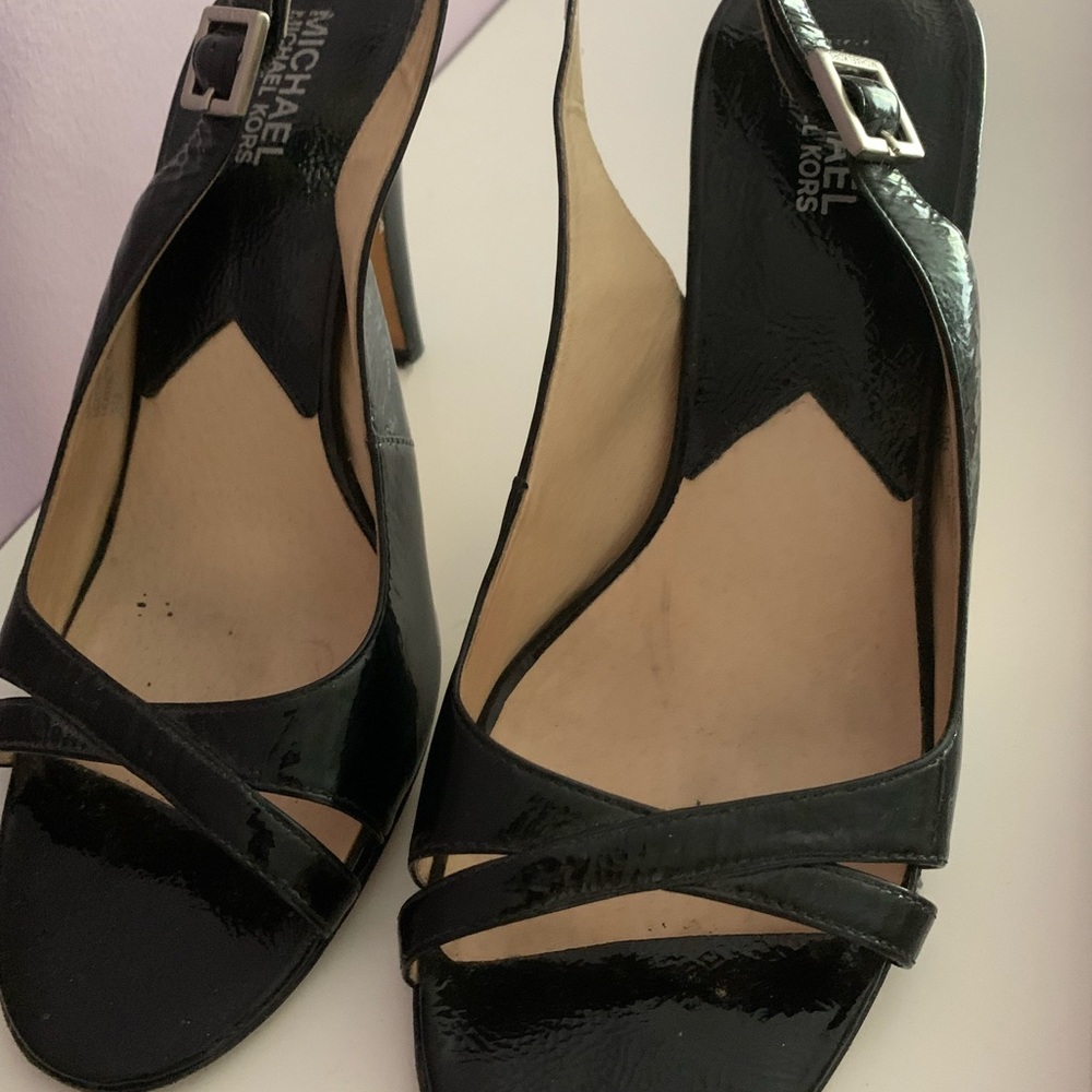 Black patent leather sandals . The heel is approx. 4 inches high